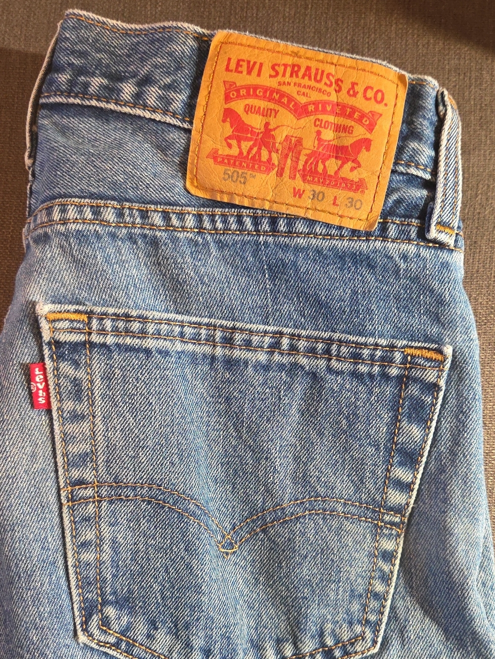 Levi's Men's Light Blue Slim Straight Jeans with Tan Patch